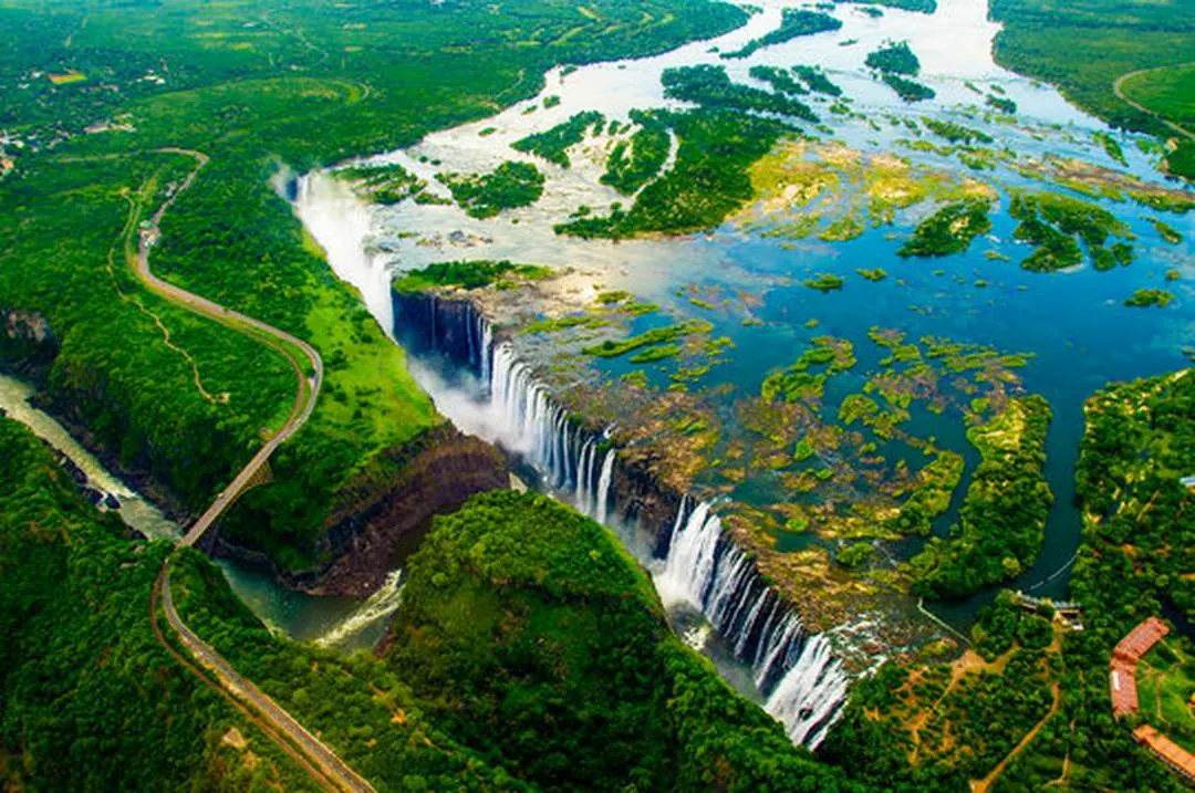 Victoria Falls from the air with the Zambezi winding above the gorge